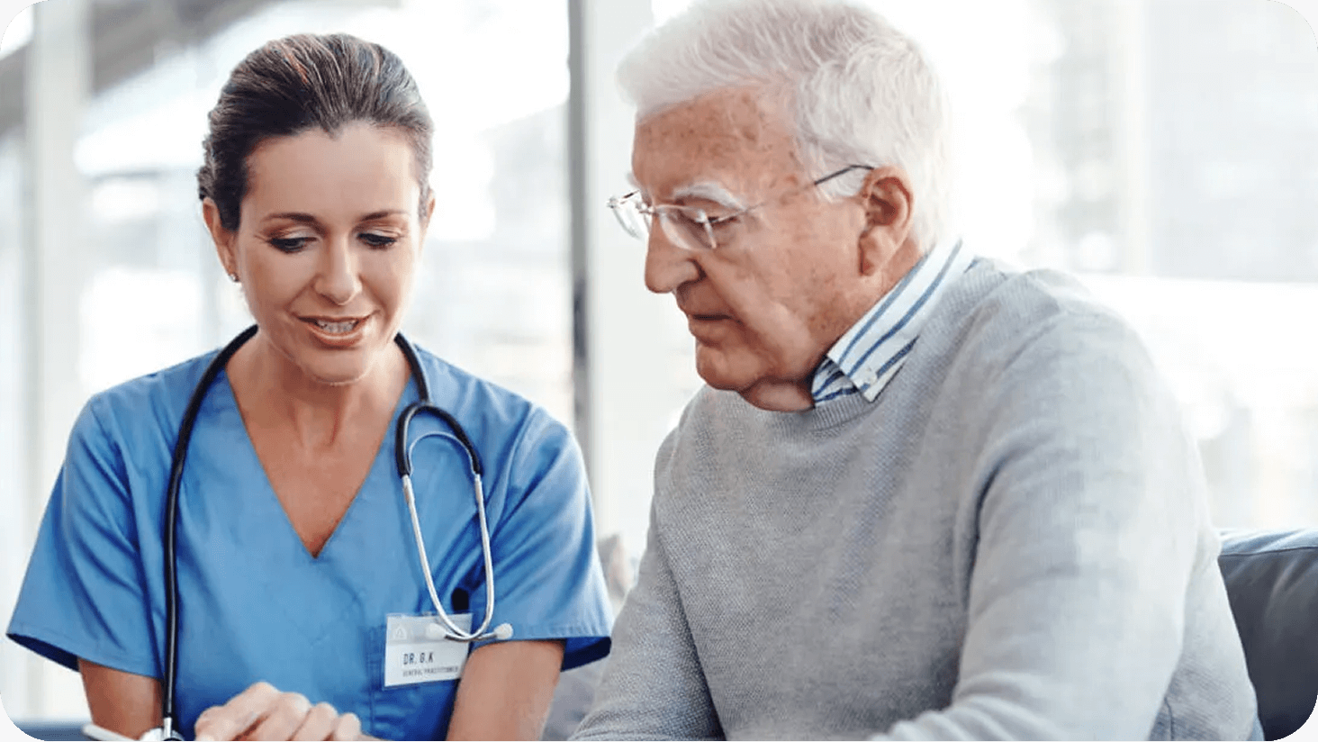Image of a nurse talking to a patient