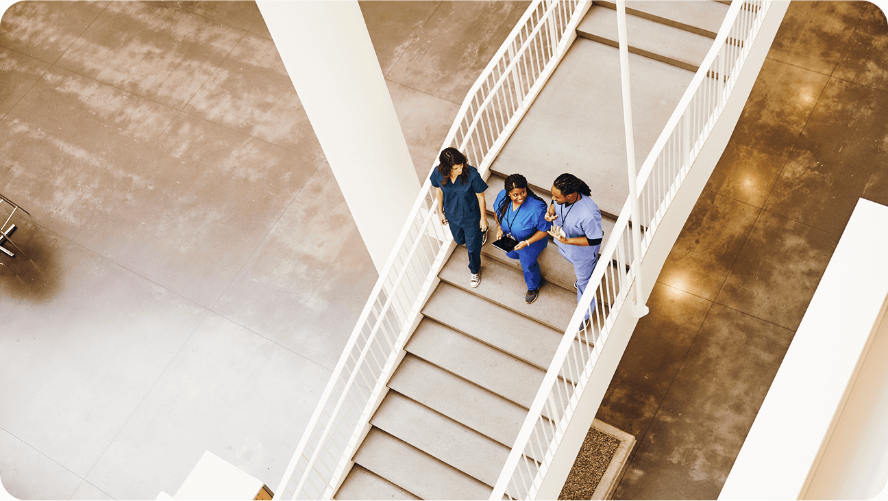 Image of nurses walking down stairs